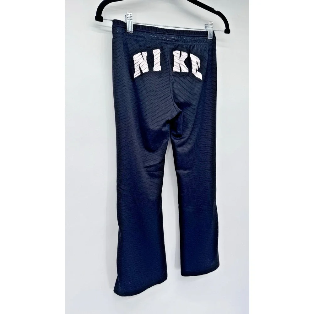 Nike girl M mesh lined snap side back logo flare pants athletic Y2K 90s preppy